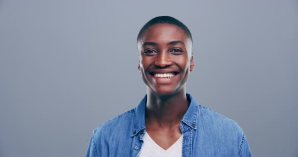 Smile, peace sign or face of black man in studio isolated on grey background with pride or confidence. Dance, happy gen z model or excited African male person with v symbol, or freedom hand gesture. - Footage, Video