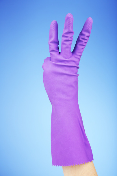 Rubber glove on hand, on blue background - Zdjęcie, obraz