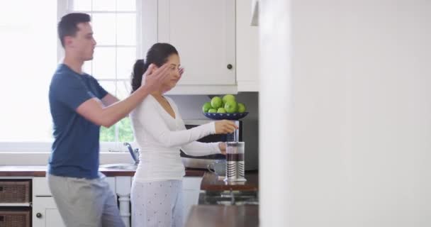 Surprise, cover eyes and couple kiss in kitchen, love and bonding together at home in the morning. Man, woman and romance, hug and relationship, connection and smile at coffee maker on valentines day. - Footage, Video