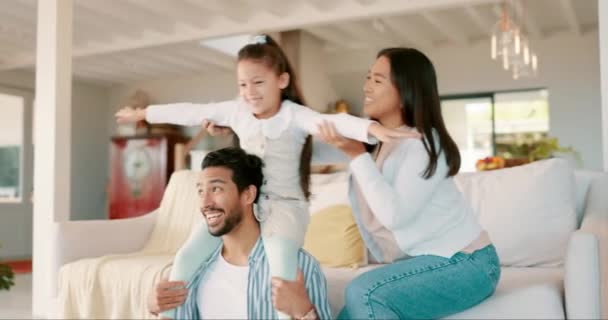 Girl, father and plane in family home, living room and game with mother, playing or happy together on sofa. Parents, kid and airplane with fantasy, care or bonding in lounge, house or laugh with love. - Footage, Video