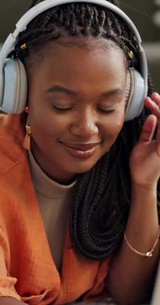Music, headphones and black woman on laptop in home living room, listening to audio and sound to relax. Smile, radio and African person on computer streaming, hearing song and enjoy freedom on tech. - Footage, Video
