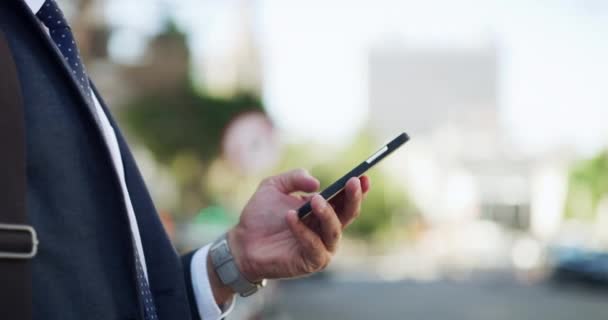 Hand, phone and a business person in the city on his morning commute while walking to work. Mobile, contact and navigation app with an employee closeup in an urban town for travel as a pedestrian. - Footage, Video