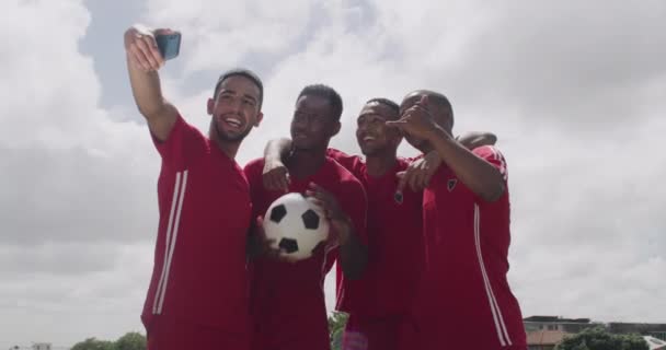 Success, stadium or soccer team in group selfie after goals, achievement or victory together on field. Happy people, ball or excited sports athletes take photo for winning a competition or tournament. - Footage, Video