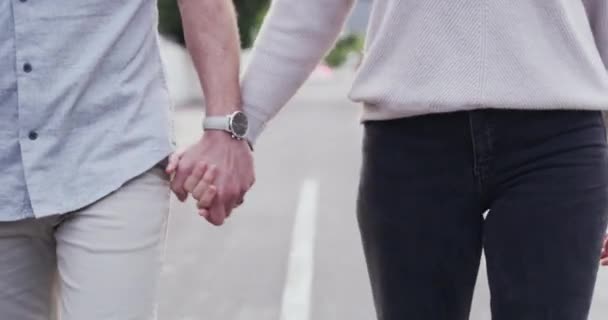 Walking, holding hands and neighborhood with couple, conversation and pointing with hobby, activity and street. People, outdoor and man with woman, road and relax with a smile, fresh air and fitness. - Footage, Video