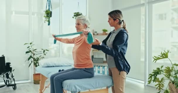 Physical therapy, stretching band or old woman doing arm exercise, recovery workout or healing client joint pain, injury or arthritis. Physiotherapy, elderly health support and test patient progress. - Footage, Video
