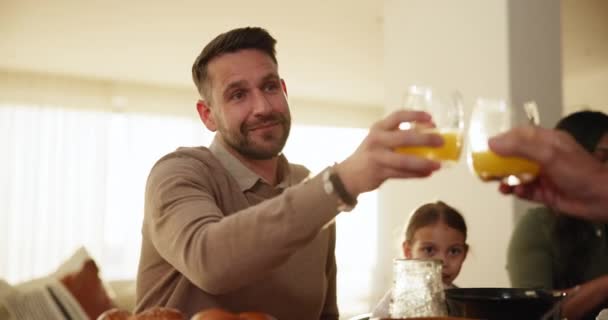 Glass, toast and a man at a family gathering with a drink for celebration at a party or event in a home. Love, smile and cheers in an apartment with a person looking happy in the holiday season. - Footage, Video