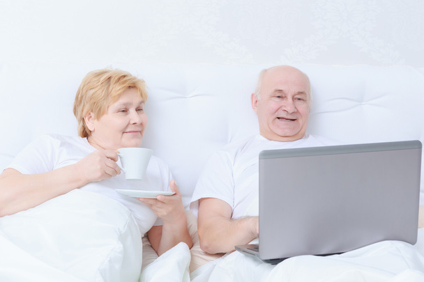 Couple interacts in bed - Photo, image