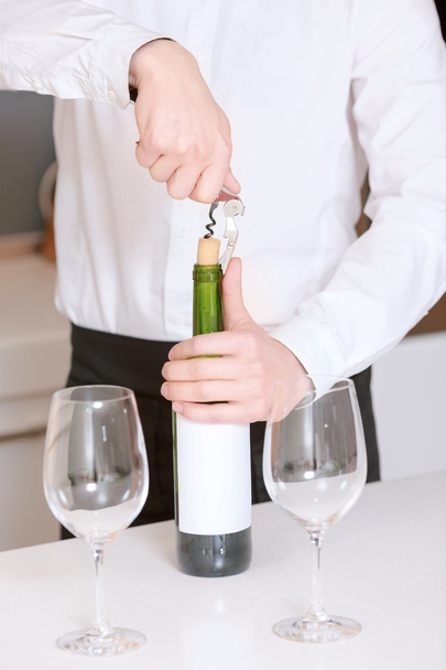 Sommelier opens a wine bottle - Photo, Image