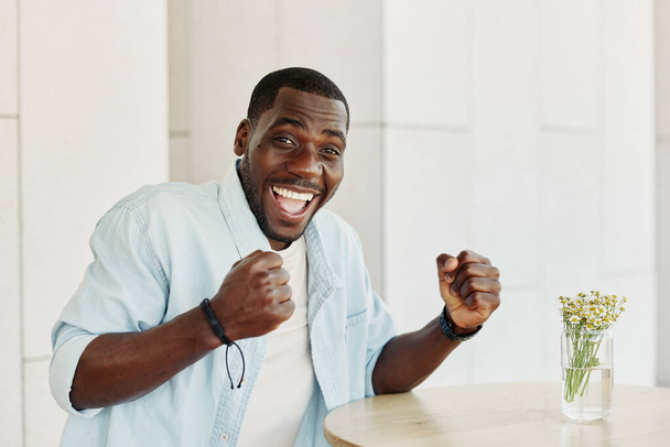 Expression man american happy looking attractive joyful handsome happiness success male confident black smile adult cheerful portrait african young excitement person guy business - Photo, Image