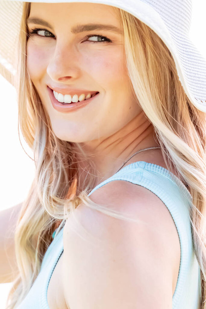 A gorgeous blonde model poses outdoors  - Fotó, kép