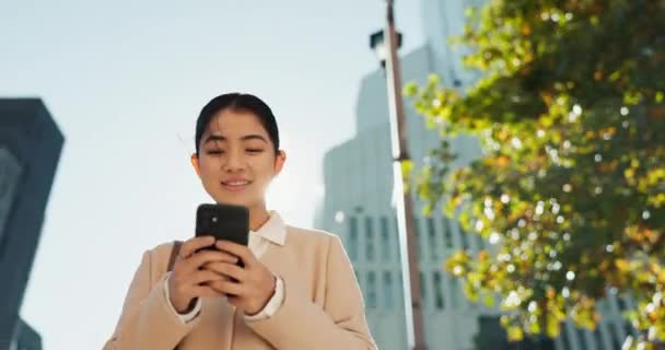 Happy woman, phone and typing in city for communication, social media or outdoor networking. Young female person smile on mobile smartphone for online chatting, texting or research in an urban town. - Footage, Video