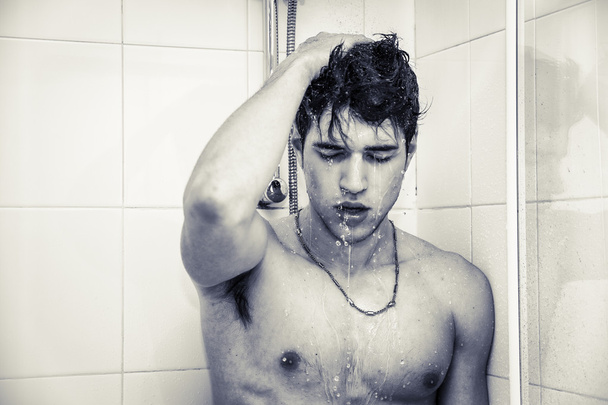 Attractive Young Bare Muscular Man Taking Shower - Photo, image