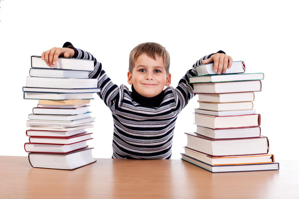 Schoolboy and   heap of books - 写真・画像