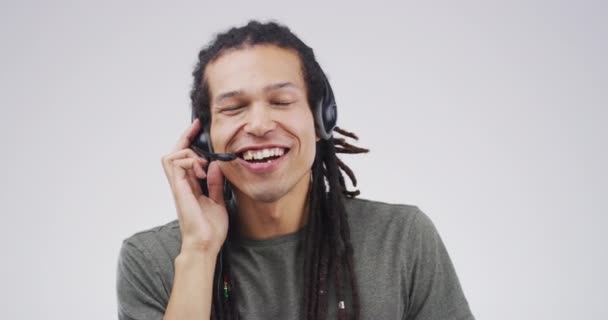 Happy, consultant and portrait in call center with support, advice and customer service. Man, speaking or contact us for telemarketing, help desk or agent in communication on studio white background. - Footage, Video