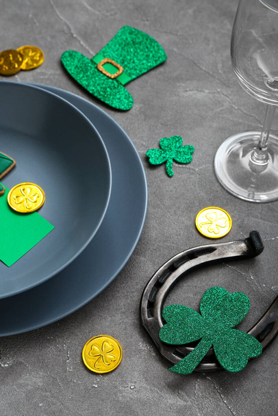 Beautiful table setting for St. Patrick's Day celebration on grey background - 写真・画像
