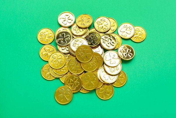 Golden coins on green background. St. Patrick's Day celebration - Фото, изображение
