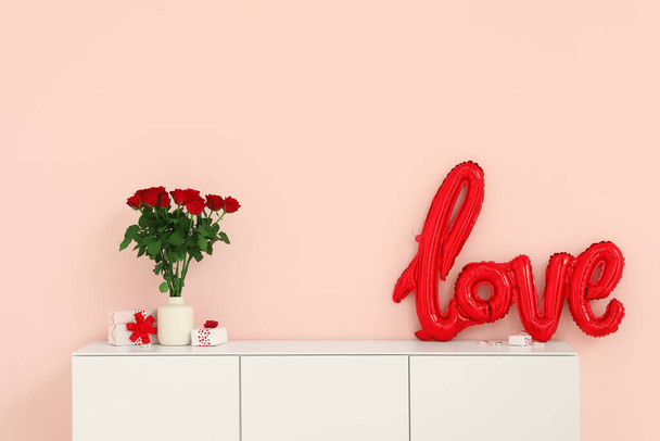 White cabinet with balloons in shape of word LOVE, gift boxes and bouquet of roses near pink wall. Valentine's Day celebration - Photo, Image