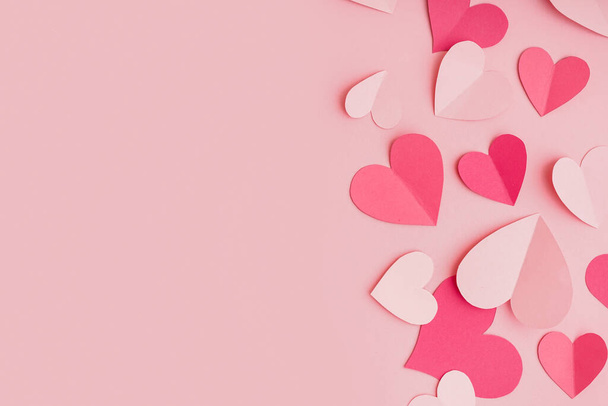 Paper hearts on pink background. Valentine's Day celebration - Fotografie, Obrázek
