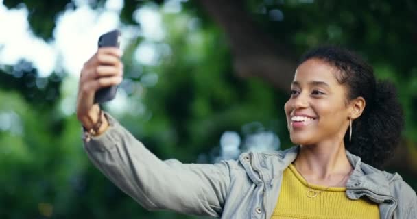Woman, student and selfie in park or city for social media, network and happy education, learning or college journey. Excited african person or influencer in profile picture and peace sign outdoor. - Footage, Video