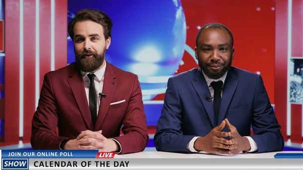 Diverse men hosting morning show live in news studio, team of reporters presenting global events on television program. Two coworkers doing breakfast tv segment to broadcast news. - Photo, Image