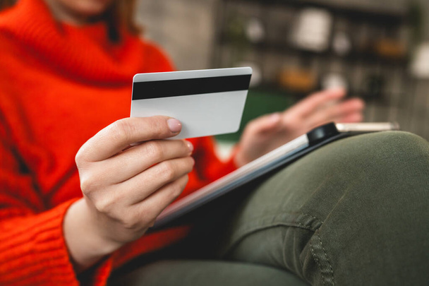 Close up on hand of unknown woman hold credit card shopping online - Zdjęcie, obraz