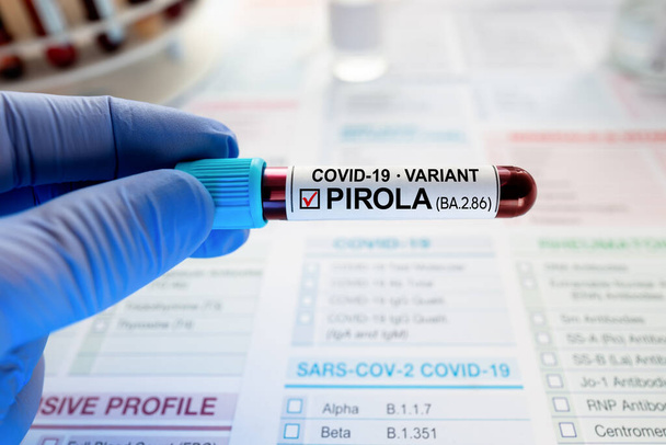 Blood sample test labeled with New Variant covid-19 PIROLA. Blood Analysis of Coronavirus Positive to Variant BA.2.86 - 写真・画像