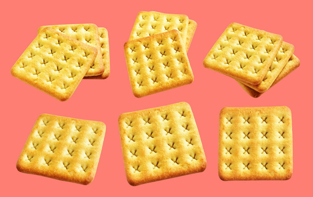 Square crackers isolated or biscuits, butter cookies with clipping path, no shadow in pink background - Fotó, kép