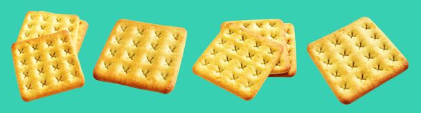 Square crackers isolated or biscuits, butter cookies with clipping path, no shadow in green background - Photo, Image