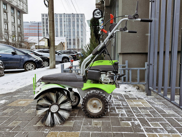 Street snow blower. Self cleaning snow from road, sidewalk. Tractor, snow removal equipment.  - Foto, Bild