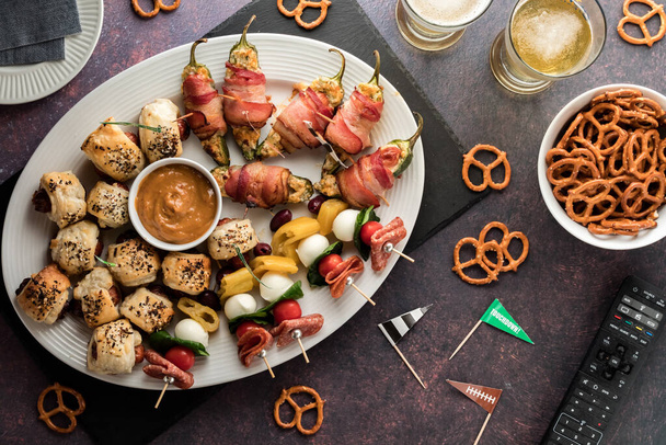 Top down view of an assortment of homemade game day appetizers, ready for sharing.  - Photo, Image