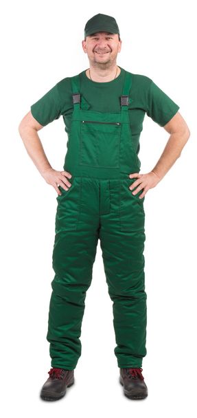 Worker in green overalls. - Foto, Bild