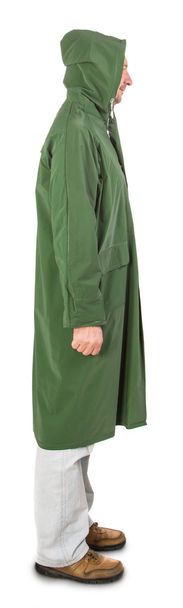 Man in rain green long coat. Side view. - Foto, Imagem