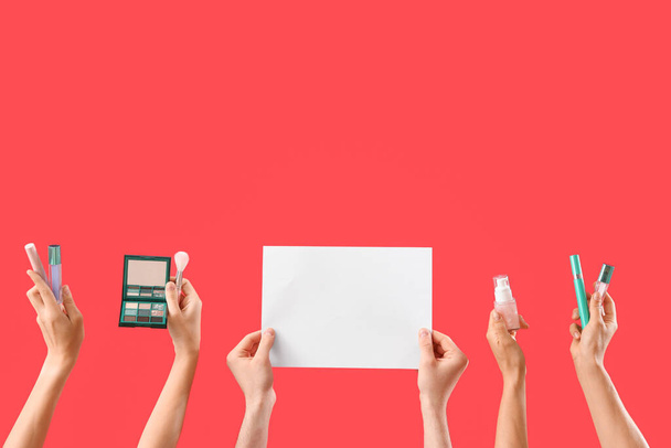 Women with makeup products and blank paper on red background - Φωτογραφία, εικόνα
