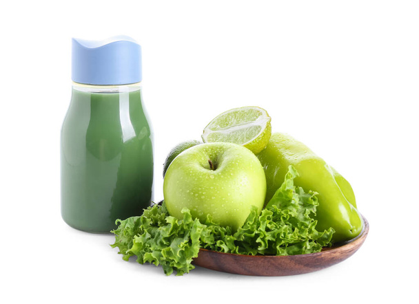 Bottle of healthy green juice with ingredients on white background - Valokuva, kuva