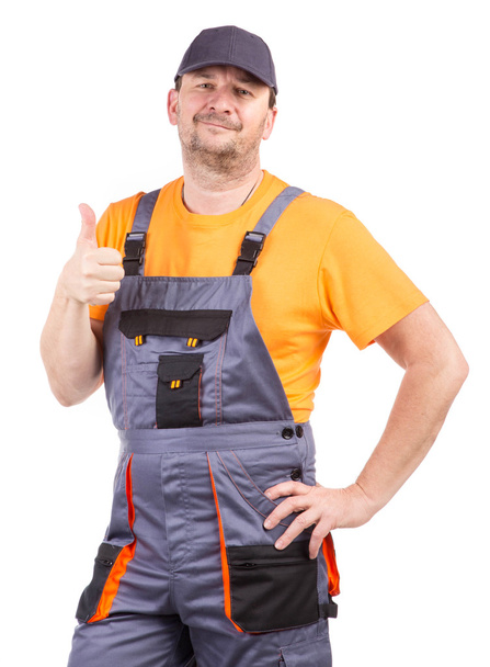 Happy worker wearing overalls. - Fotoğraf, Görsel