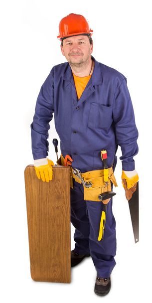 Worker with saw in hand. - Photo, Image