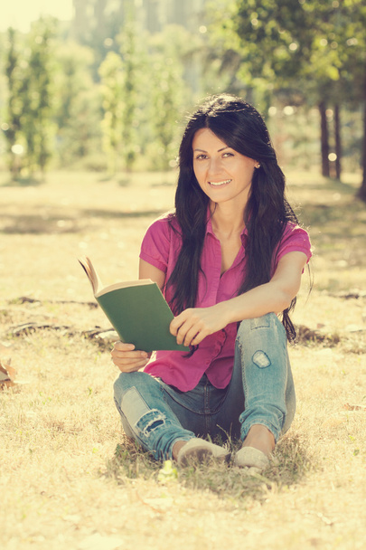Woman is reading a book and enjoy in her free time - Photo, image