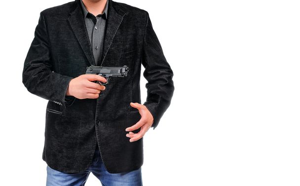 Young man with pistol - Foto, afbeelding