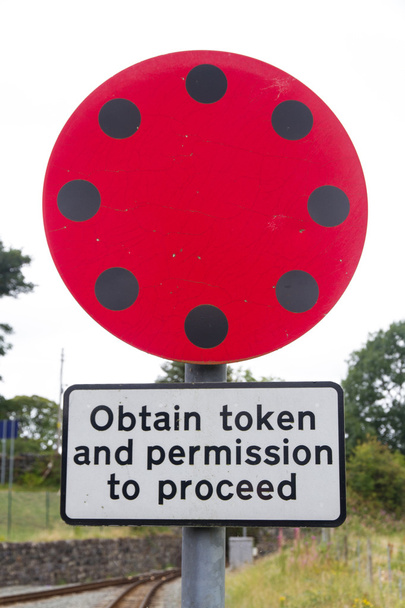 Railway Sign Obtain token and permission to proceed. - Photo, Image