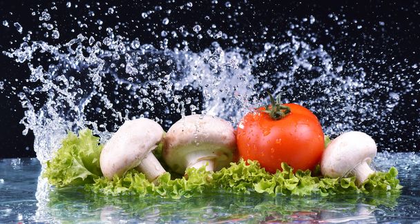 Red tomato, mushrooms and salad with water drop splash - Photo, Image