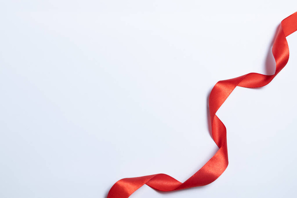 Red ribbon on empty white background with place for photo or text - Photo, Image