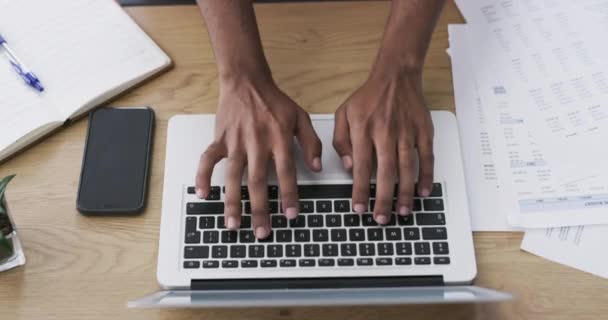 Hands, laptop and documents for finance, accounting and taxes research, management or planning at desk above. Business person typing on computer with paperwork, budget report or project invoice. - Footage, Video
