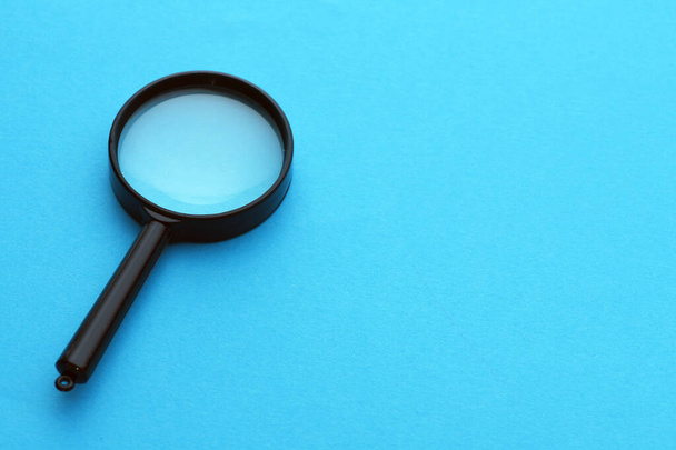 magnifying glass magnifier loupe search symbol on blue background with copy space - Photo, Image