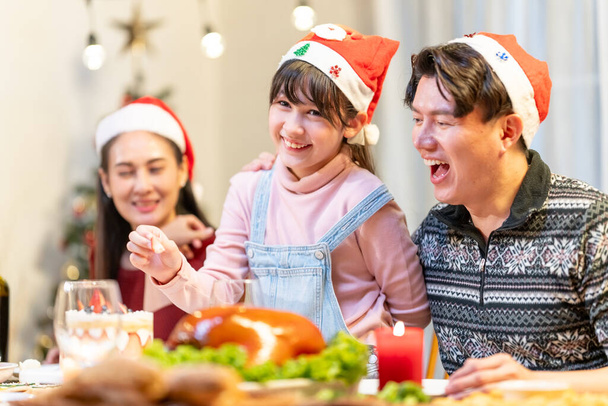 Merry Christmas! Happy family having dinner at home. Celebration concept - Photo, Image