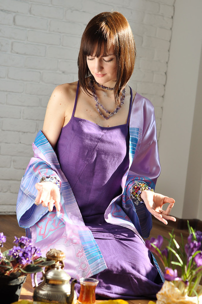 Beautiful girl in eastern dress in meditation - Photo, Image