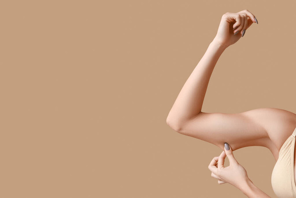 Female hands on beige background, closeup. Plastic surgery concept - Photo, Image