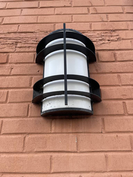 Vintage exterior wall light on a brick wall looking up - Photo, Image