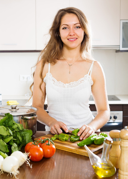 woman in apron at home kitchen - Фото, изображение