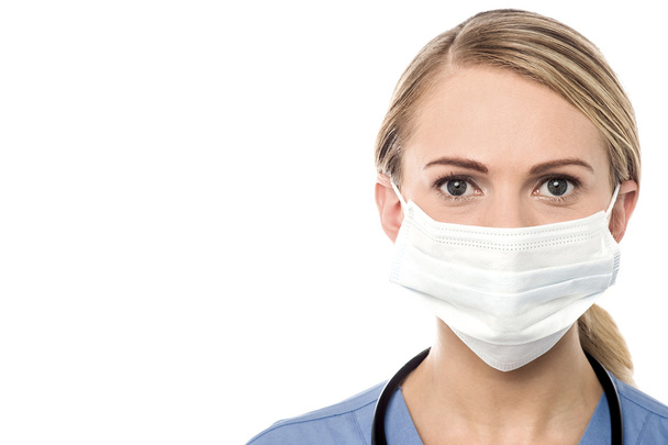Doctor with surgical mask - Foto, afbeelding