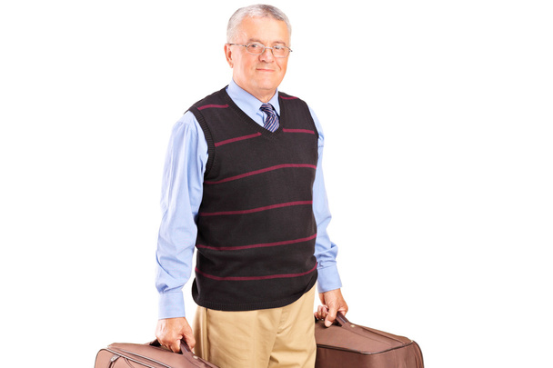 Senior gentleman carrying two bags - 写真・画像